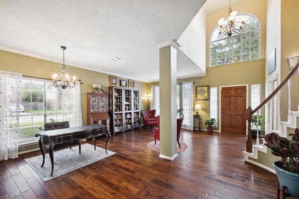 The soaring cathedral ceilings are truly impressive as you enter your new home.
