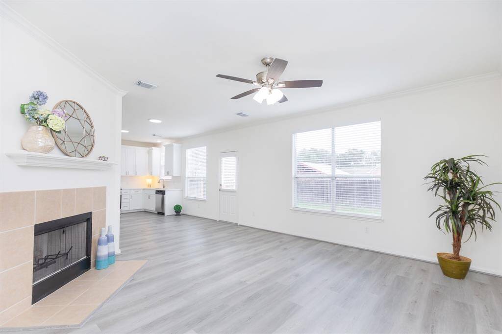 Gorgeous family room with fireplace, luxury vinyl thru the first floor, new ceiling fan, fresh paint