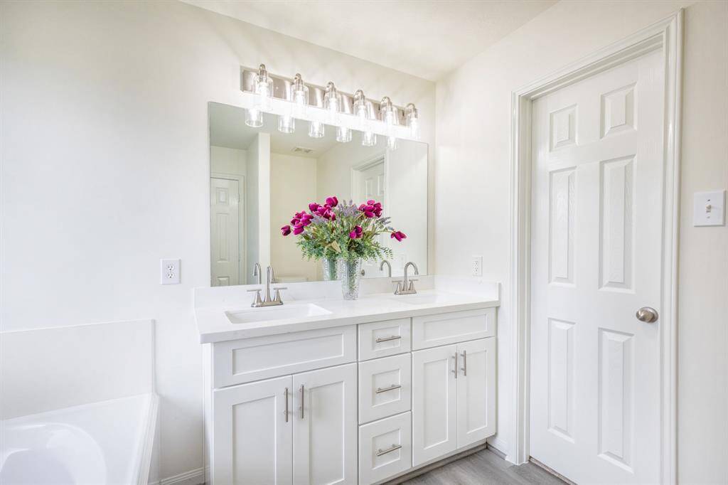 Wonderful Primary bathroom with new cabinets, new facet, new light, new garden tub, and new shower