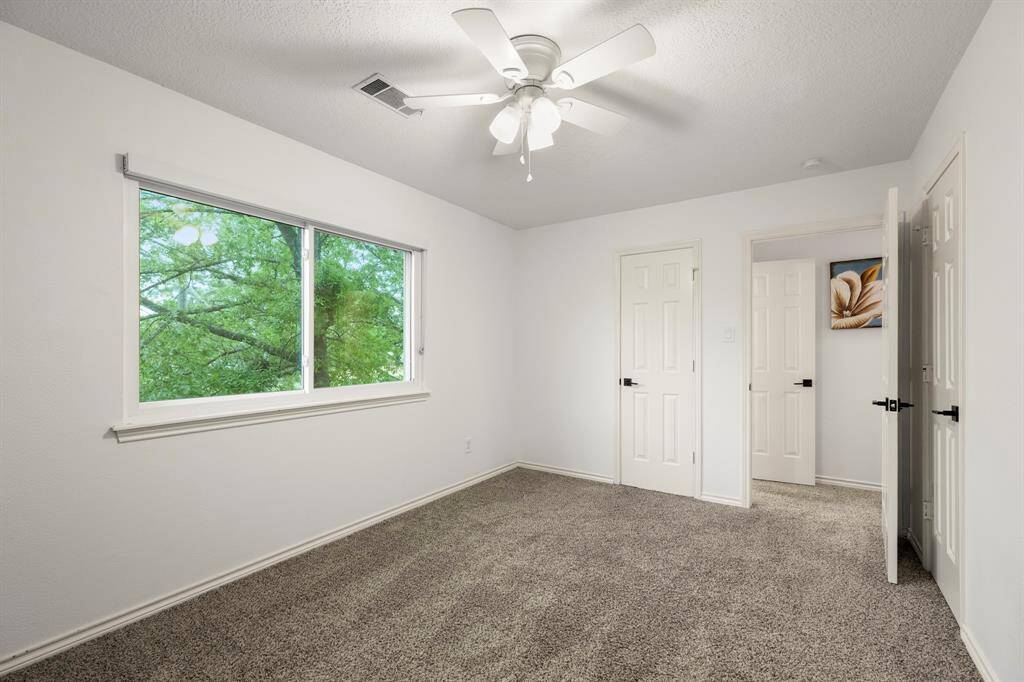The other connecting bedroom upstairs, accessed through the bathroom, offers a spacious and comfortable retreat. With ample natural light and plenty of room for furniture, it provides a versatile space that can be customized to suit your needs.