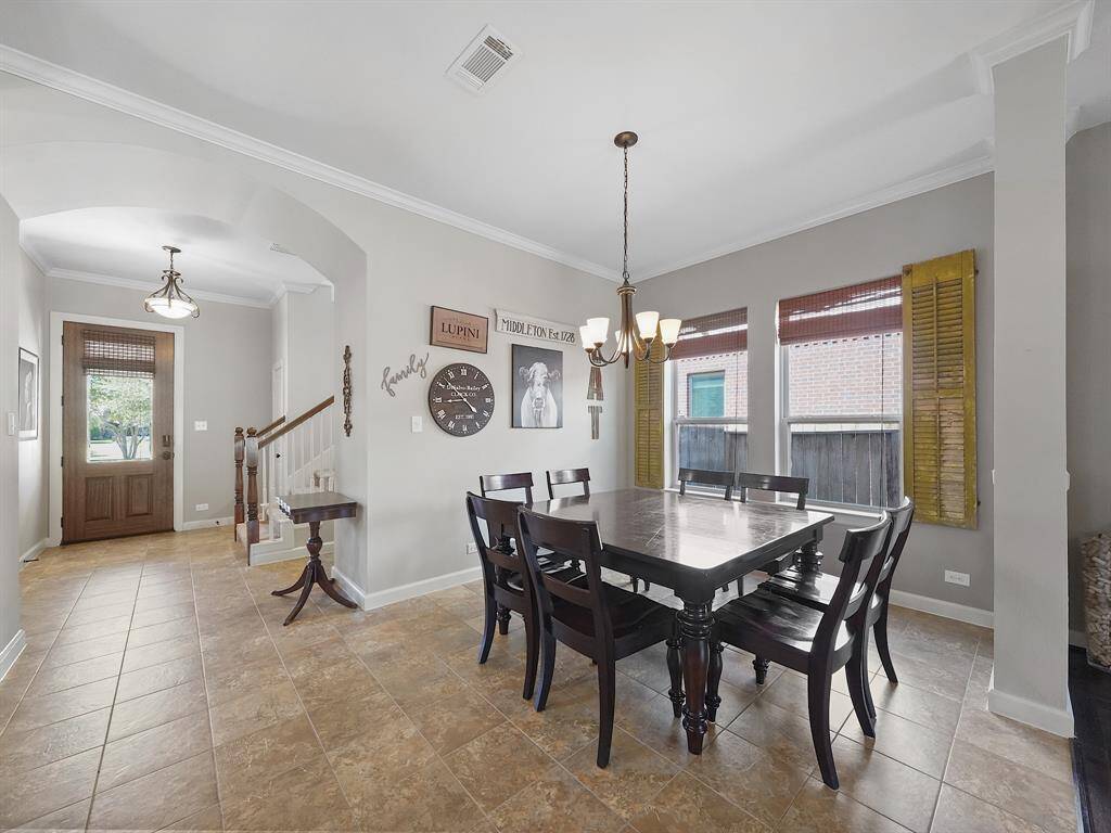 Spacious dining room adjacent to the kitchen has large windows allowing ample natural light!