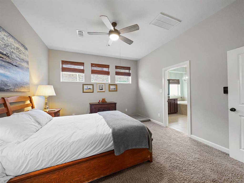 Escape to the luxurious primary retreat, a private sanctuary designed for relaxation and rejuvenation.