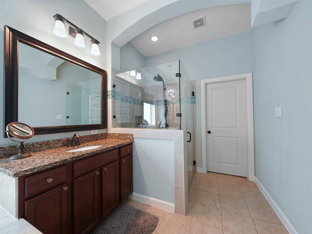 The dual vanities provide ample space for getting ready in the morning, ensuring a stress-free start to your day.