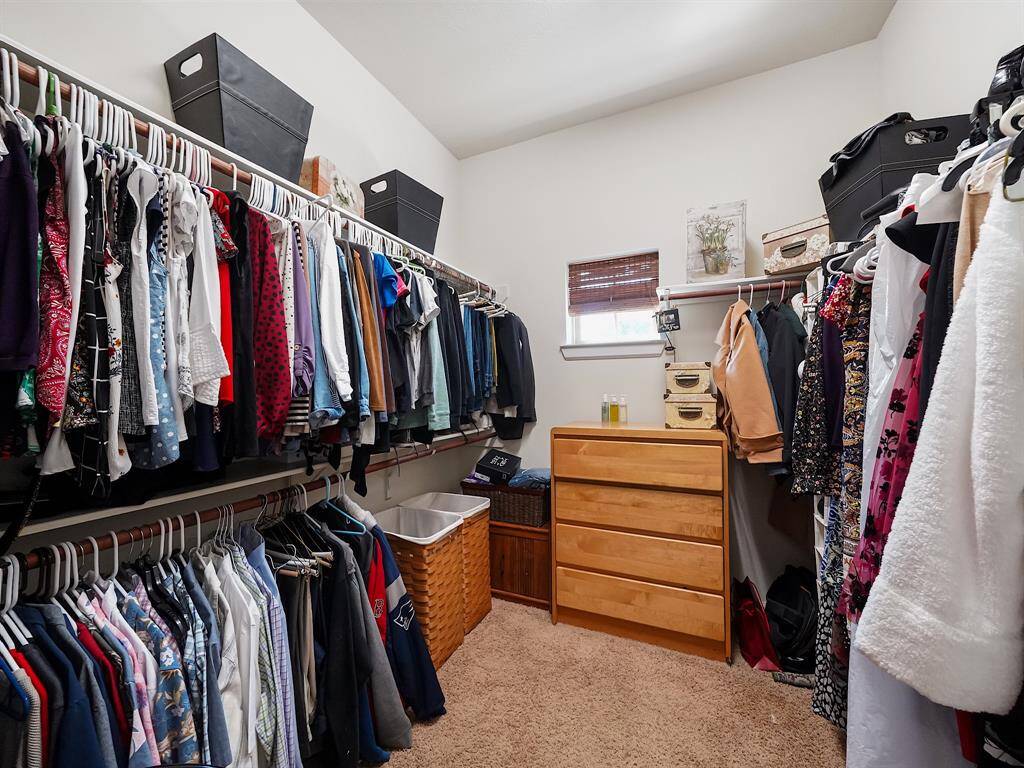 The large walk-in closet offers plenty of storage for your wardrobe and accessories.