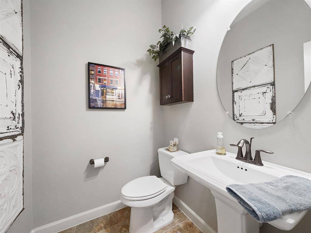 A half bathroom downstairs adds convenience for guests.