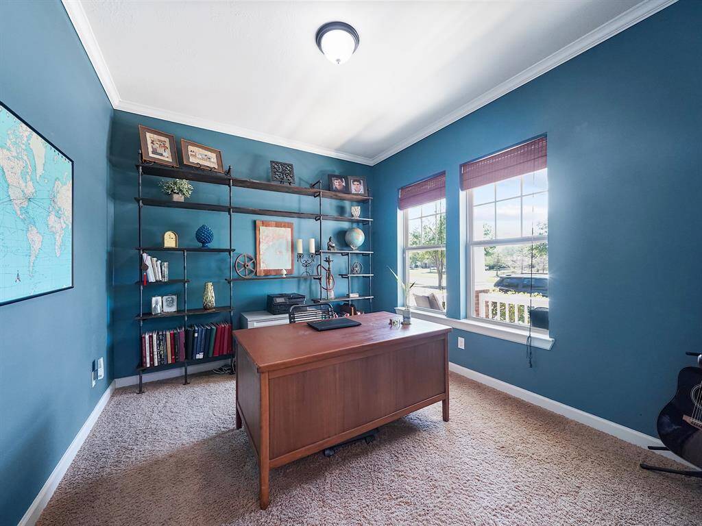 To your right, discover a private office enclosed by charming French doors, offering the perfect space for productive work-from-home sessions or serving a multitude of other purposes, from a cozy reading nook to a creative studio.