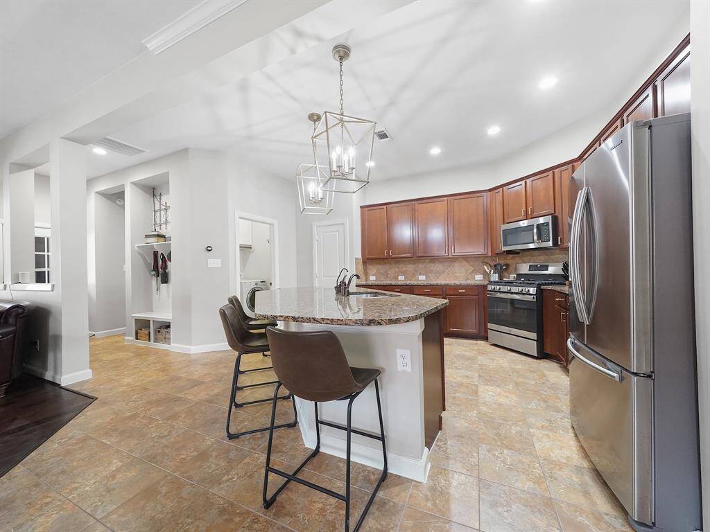 Abundant storage and counter space ensure that everything is within easy reach, making cooking and entertaining a breeze.