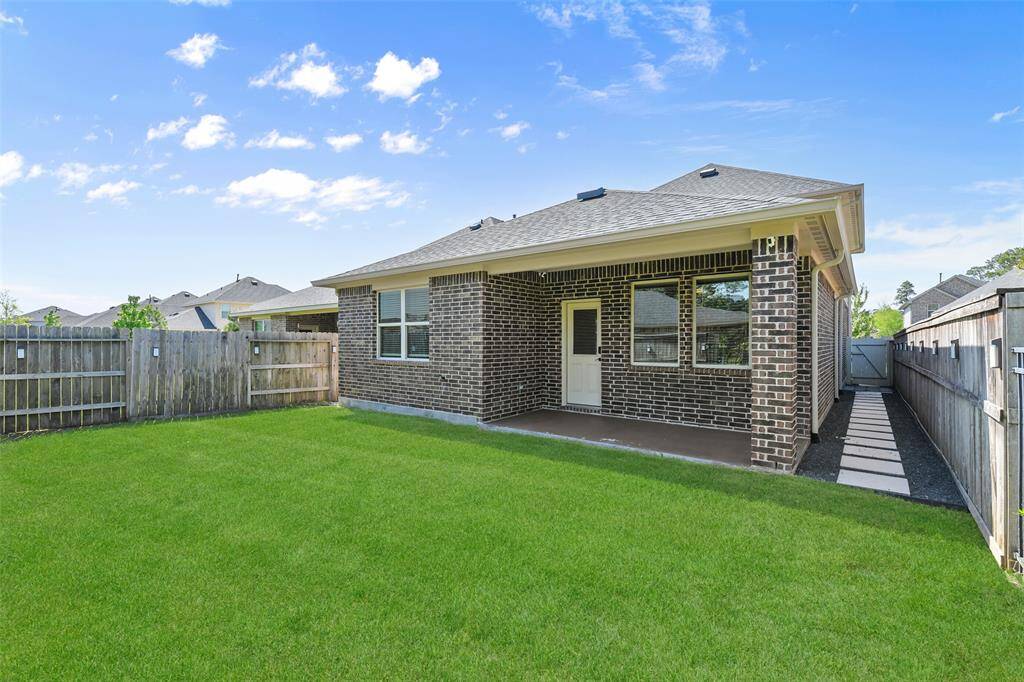 Sellers added pavers along both sides of the house and full gutters!