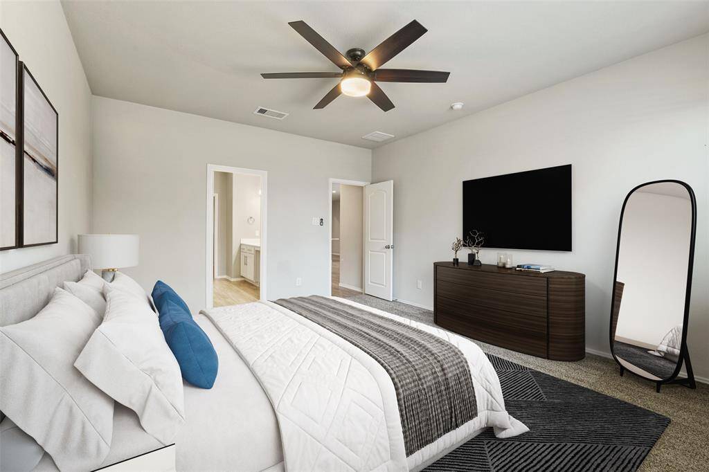 Primary bedroom with fan and reserve views!Virtually Staged