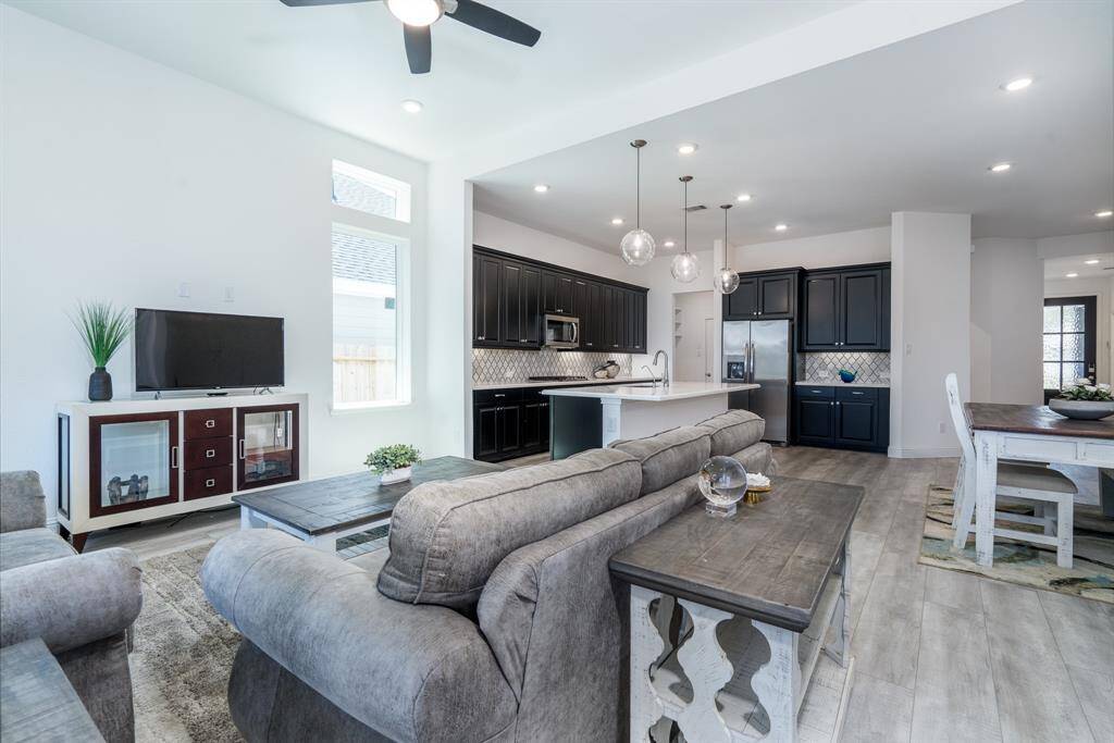 You can see how the living, dining and kitchen create a wonderful space that is perfect for entertaining.
