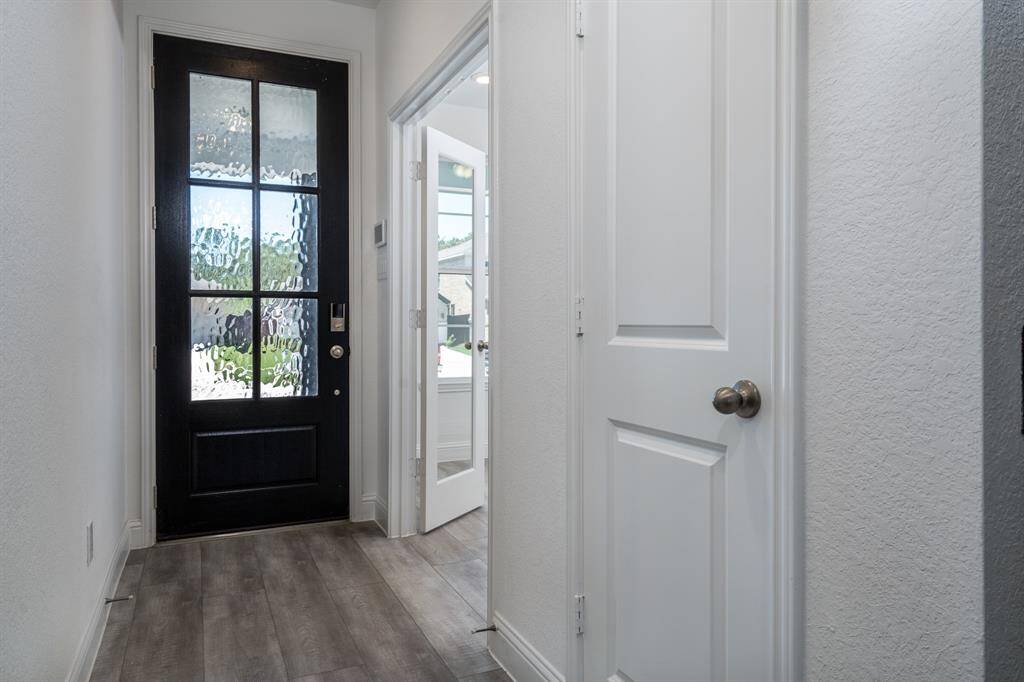 Looking at the front door, the home office is to the right.