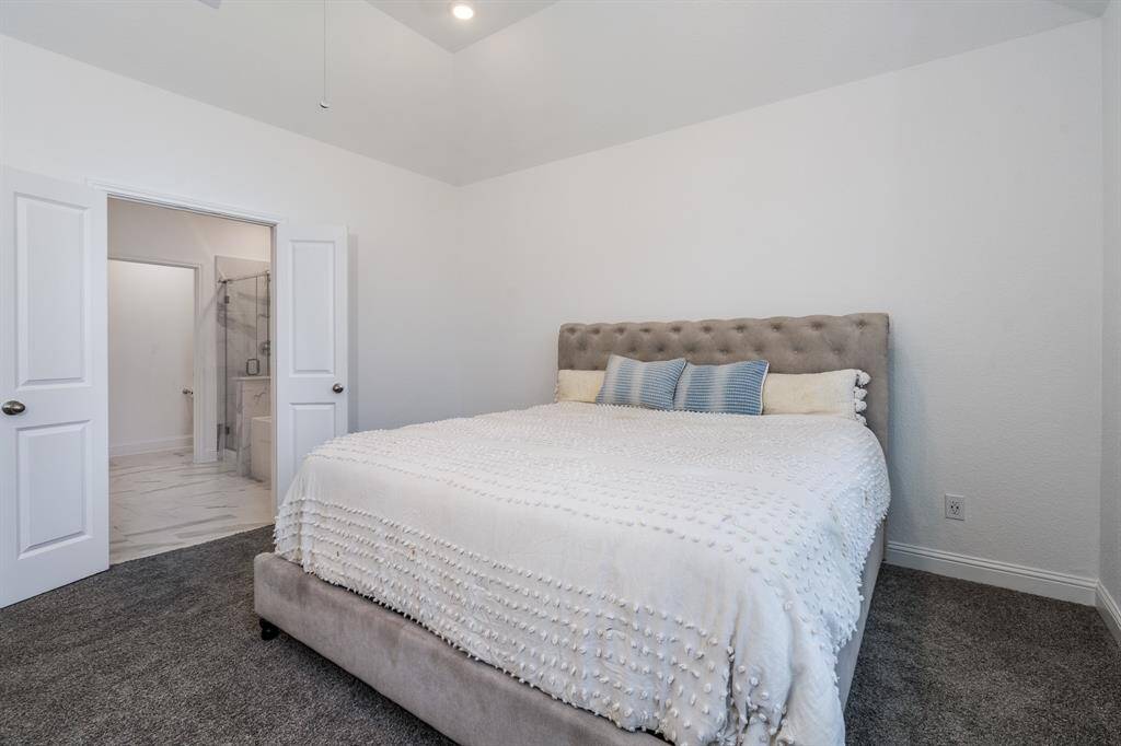 Another view of the owner's suite with a peek into the bath.