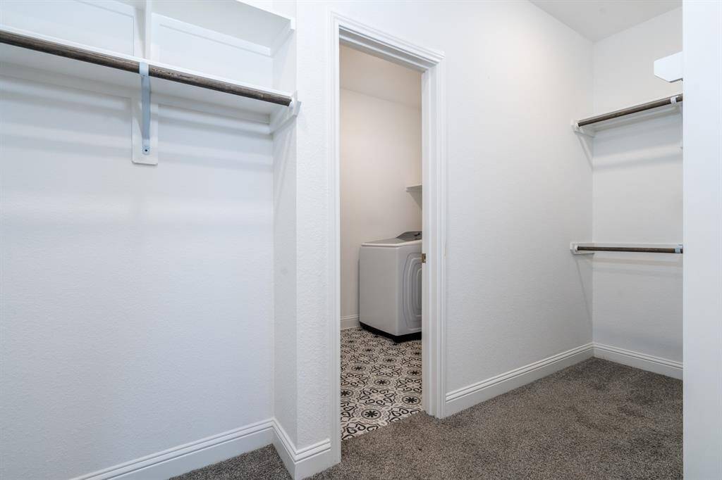The primary closet also has a door to the utility room.  You don't have to go far to get the laundry done, folded and put away.