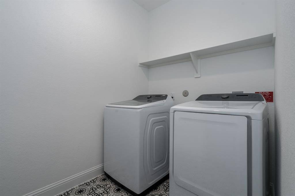 The laundry room with it's pretty tile floor.
