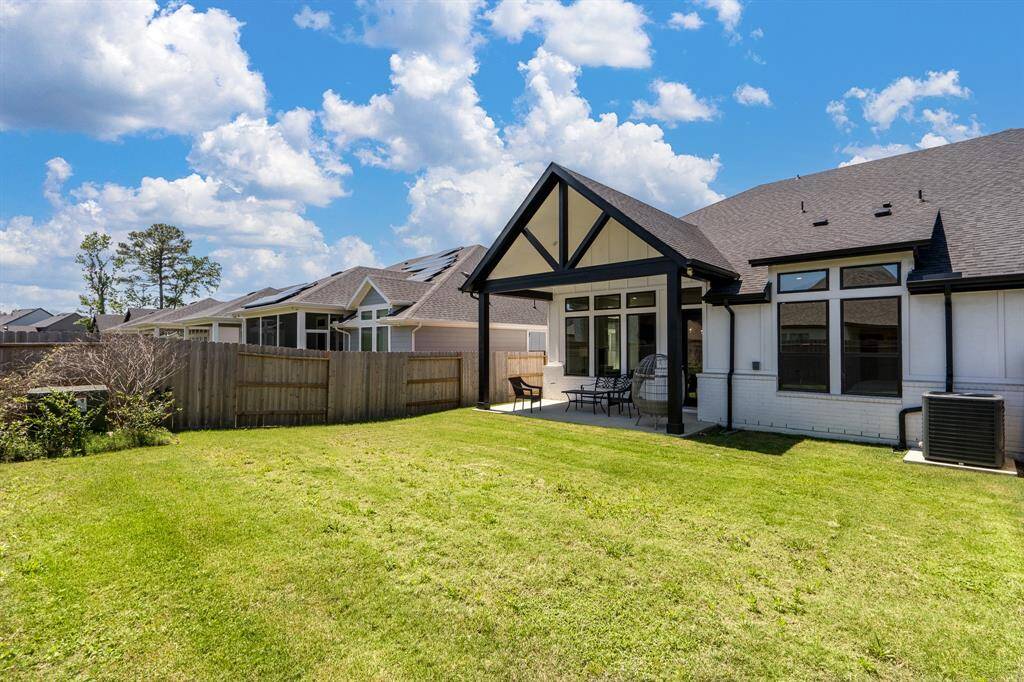 Just look at this spacious backyard and patio. This home has a full set of gutters covering the entire home.