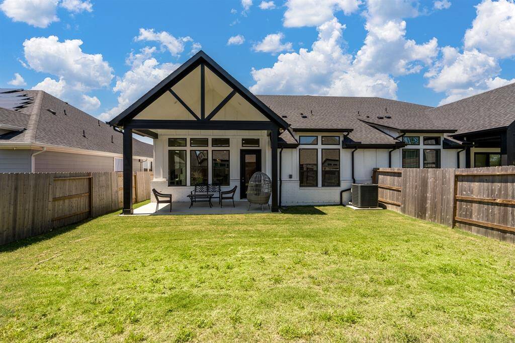 The fully fenced, private backyard has a covered patio and gas stub out for an outdoor kitchen.