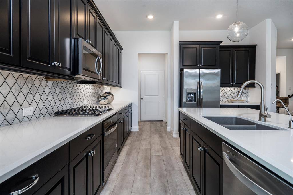 Just look at all this counter space and available storage.  Plus next to the refrigerator is the perfect spot for a coffee bar.