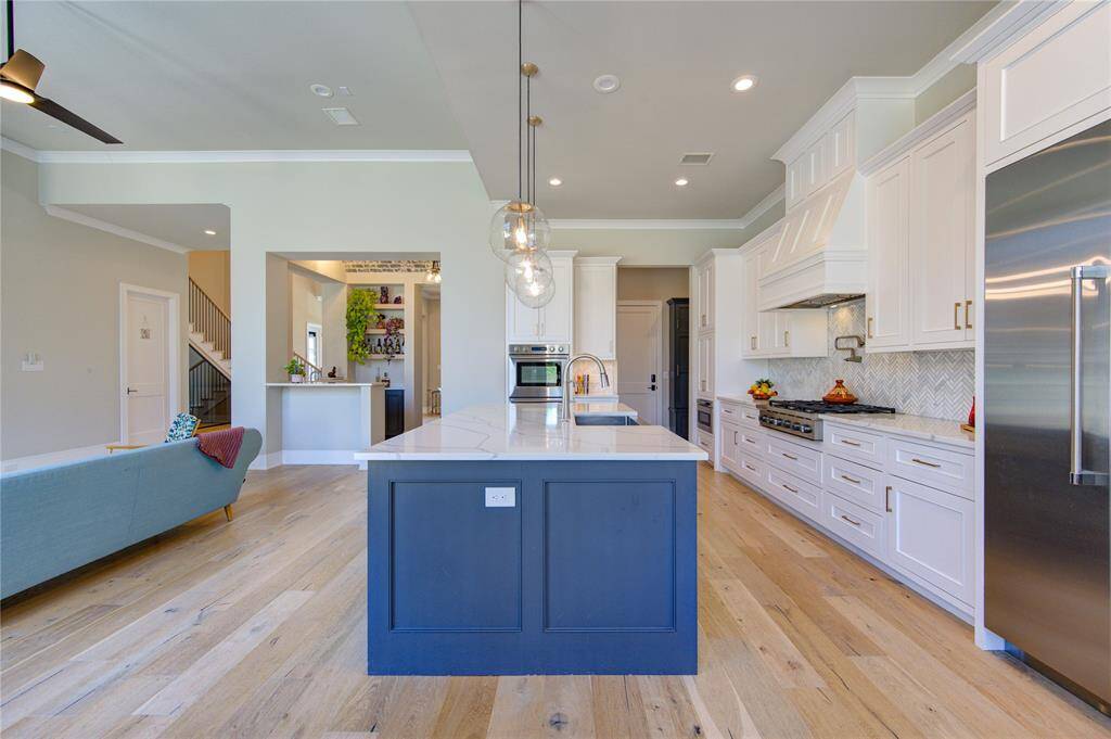 Experience the elegance of this spacious, open-concept kitchen.