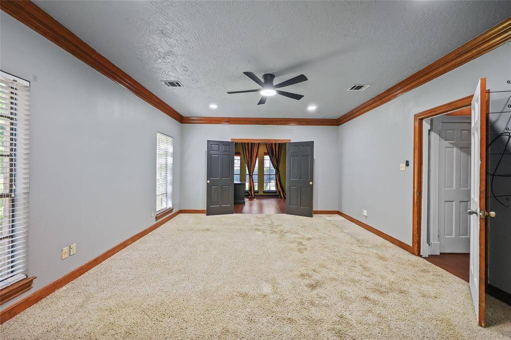 primary bedroom downstairs connected with a office