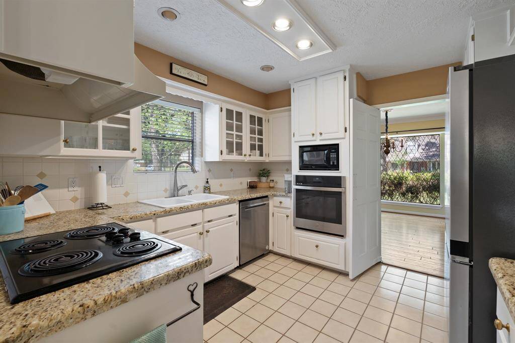 The picturesque window over the sink overlooks the driveway.