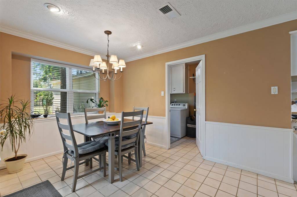 Another eating area with the light and bright breakfast room! This door leads into the laundry room.