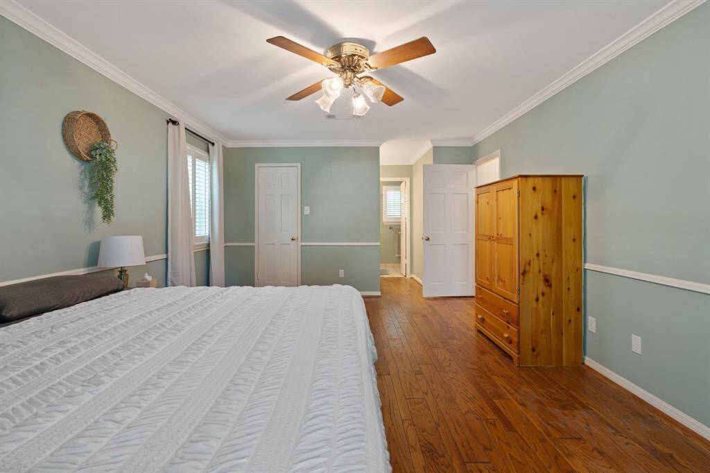 This room boasts a walk-in closet, vanity and en-suite bathroom.