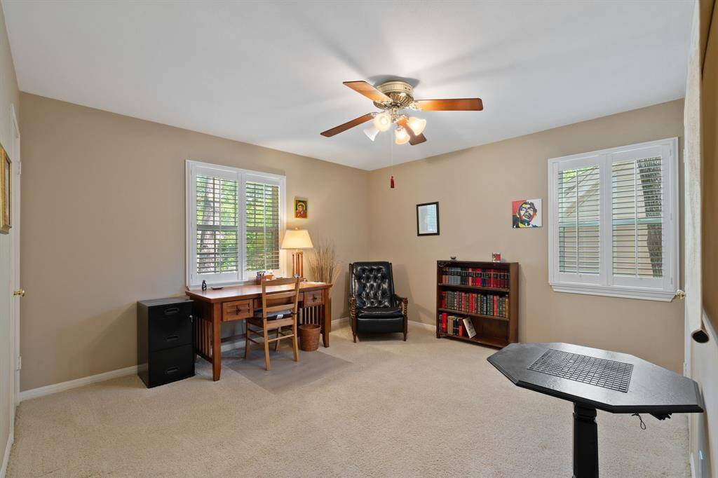 The first of the secondary bedrooms in located at the front of the house and is currently being used a home office/study.