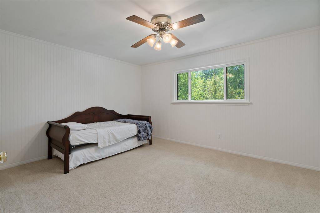 Just across the hall is a newly remodeled second secondary bedroom. This room overlooks the backyard and is a dream!