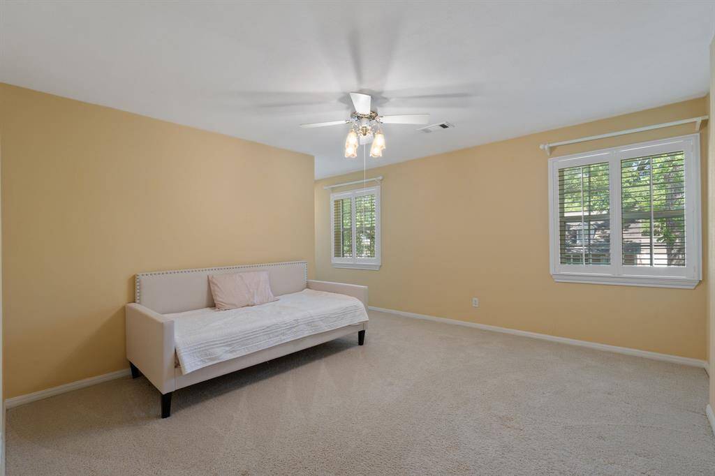 Just down the hall is the third of the secondary bedrooms.