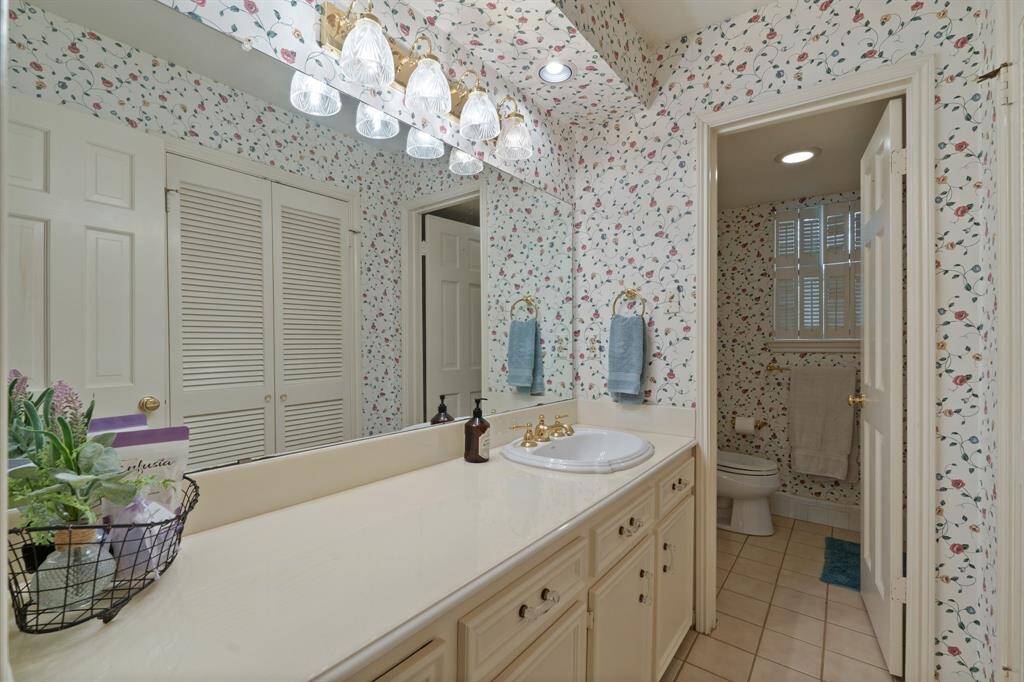 Across the hall is the upstairs secondary bathroom.
