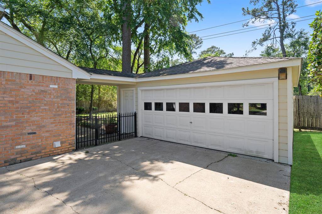 Detached 2 car garage with a covered breezeway to the house.