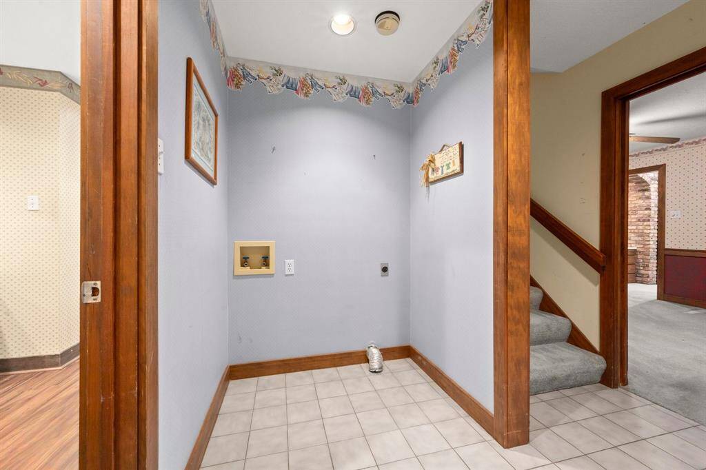 Washer and dryer room that connects to the dining area.