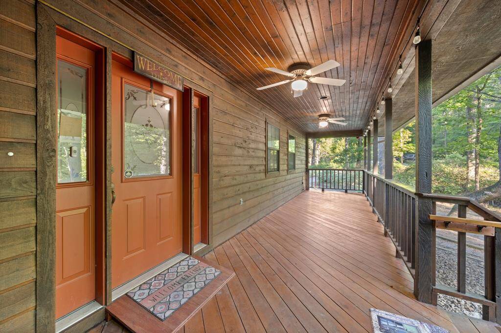 Front door of the home with a covered "patio" area.