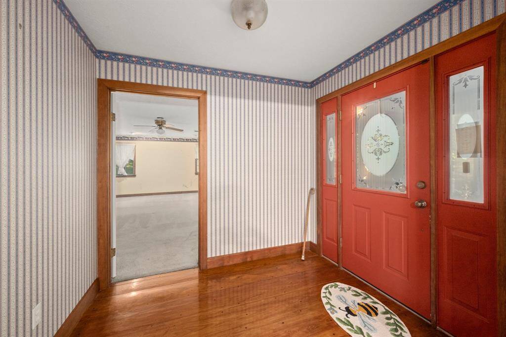 Entry way into the home and shows the 1st bedroom to the right when you walk in.