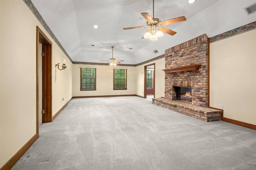 This is the living area to the left when you walk through the front door with the double sided fireplace.