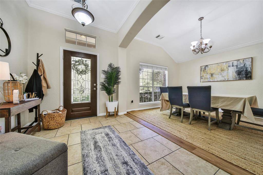 The home features an open entry. Immediately to the left (not pictured) is the door to the garage.