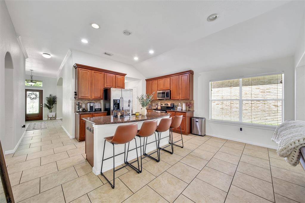 This space is the breakfast room and is large enough for a big table.  This space is another great option for a play space or additional sitting area for families that choose to use the formal dinging room as their dining space.
