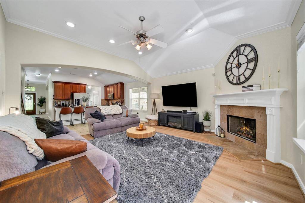 Family room featuring newly installed flooring and a great corner fireplace.