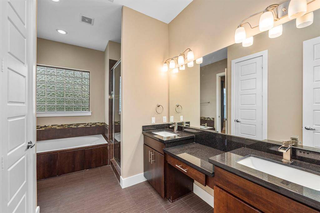 Primary Bathroom with dual sinks and vanity area!