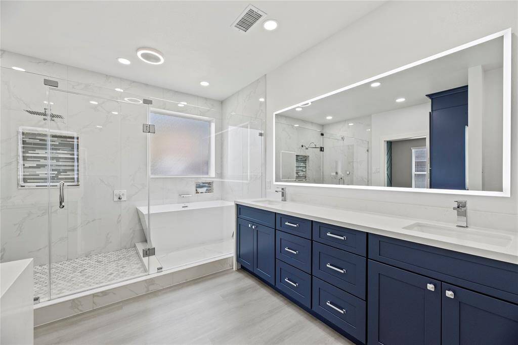 An abundance of quartz counters and soft close cabinets and drawers makes this an easy space to share.