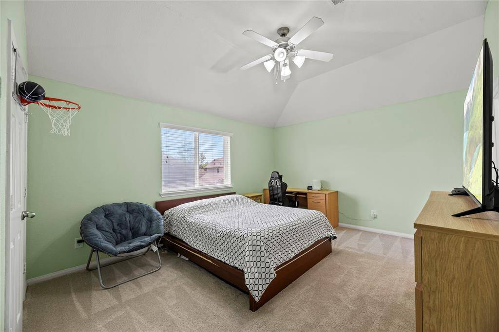 One of four primary bedrooms upstairs.  New carpet in all the bedrooms!