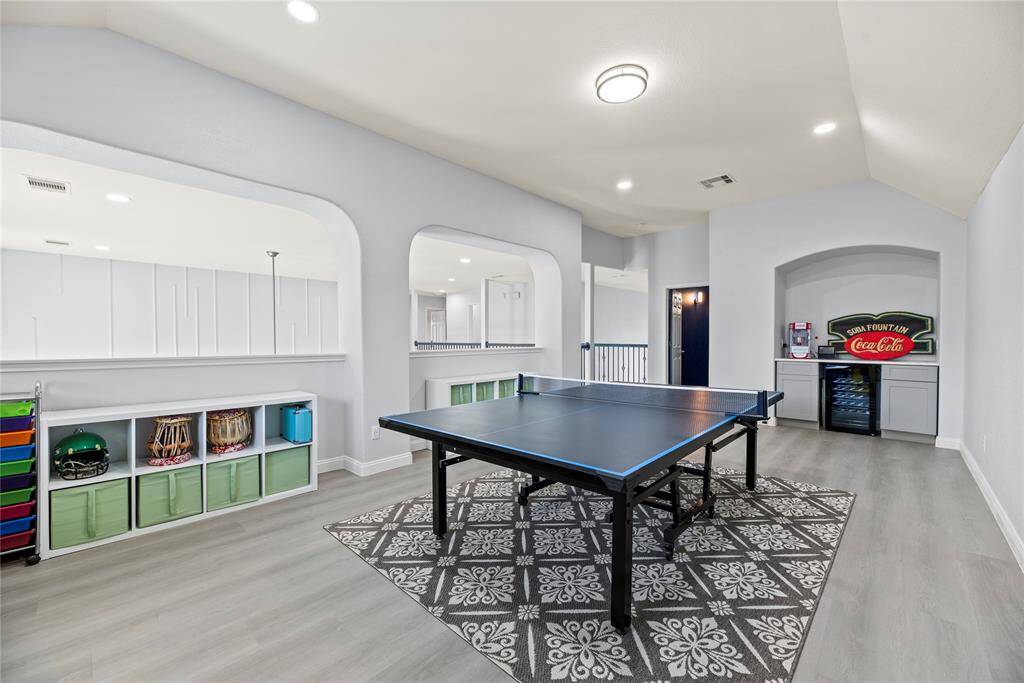 The game room also has a built in dry bar with a beverage refrigerator!