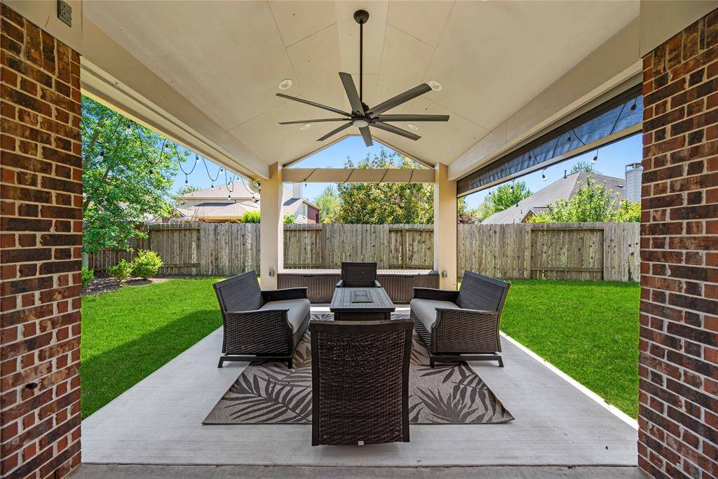 Check out the enormous back patio complete with electronic shade!