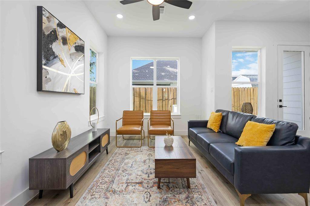 The door to the right leads to a fenced in green space to enjoy the outdoors.