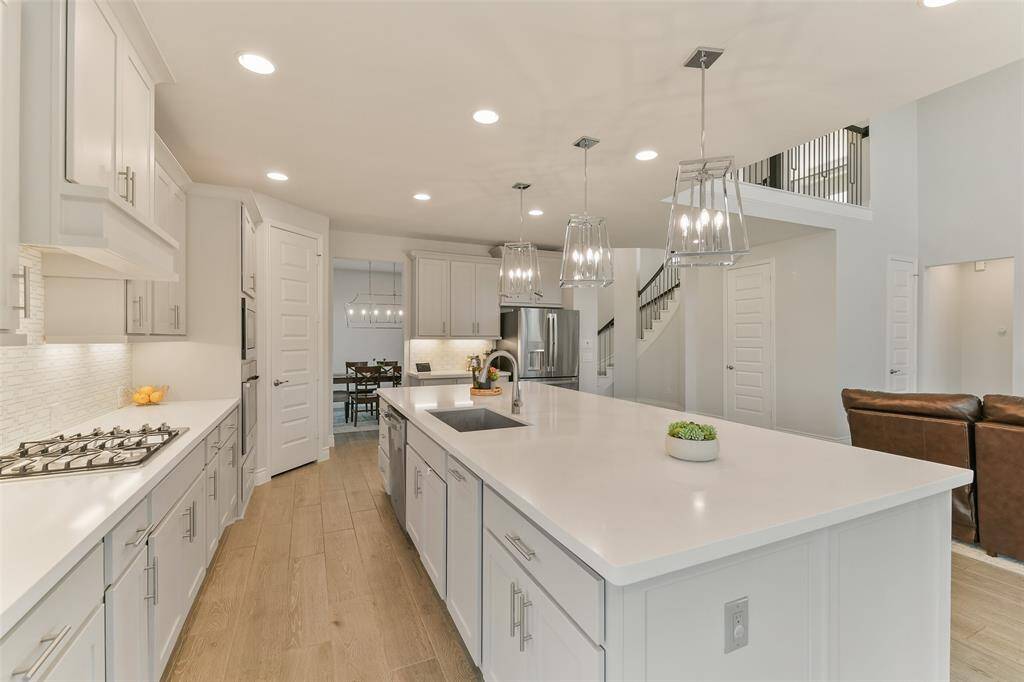 The cook never feels left out of the action in this kitchen. Plenty of space to create masterpieces. Trash drawer is conveniently located beside the sink.