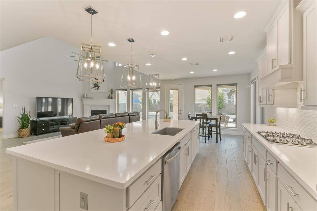 Pots and pan drawers increase storage opportunities. Even the kitchen has views of the backyard and pool.
