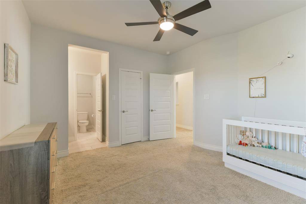 Fourth bedroom, on the second floor, has a ceiling fan, walk-in closet, and connects to the Hollywood bath with its own private sink area. It also has a small door for attic access.
