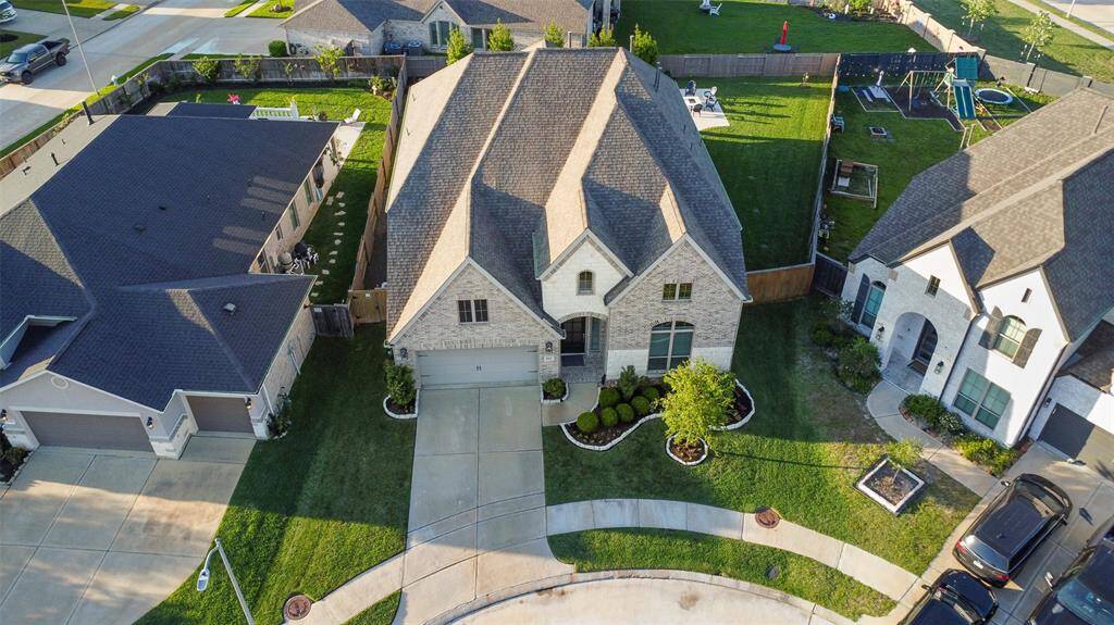 Situated on a half culdesac, this home has a long driveway and extra space between it and the neighbors.
