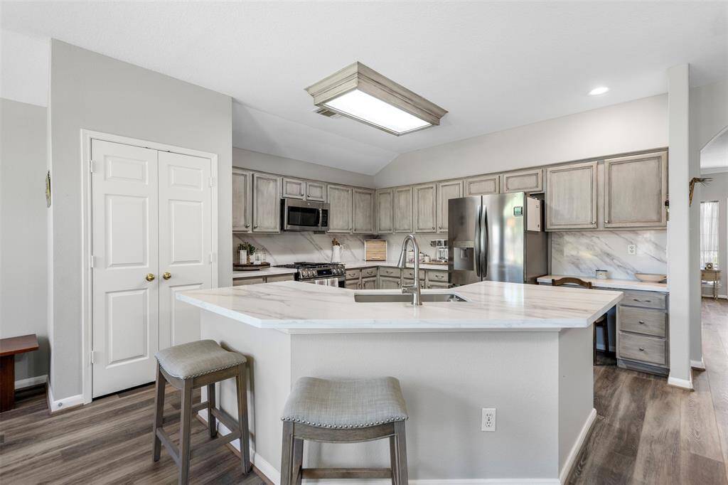 This updated kitchen is a chef's dream.  Check out all of the cabinets...storage space galore!