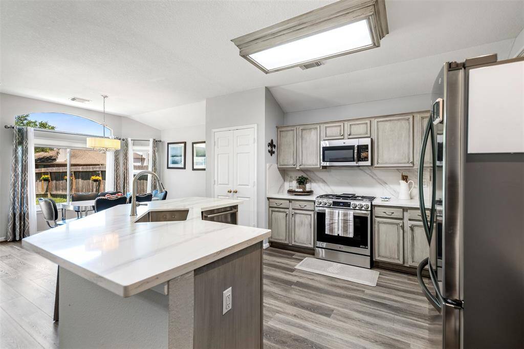 The kitchen also offers seating at the counter height island.
